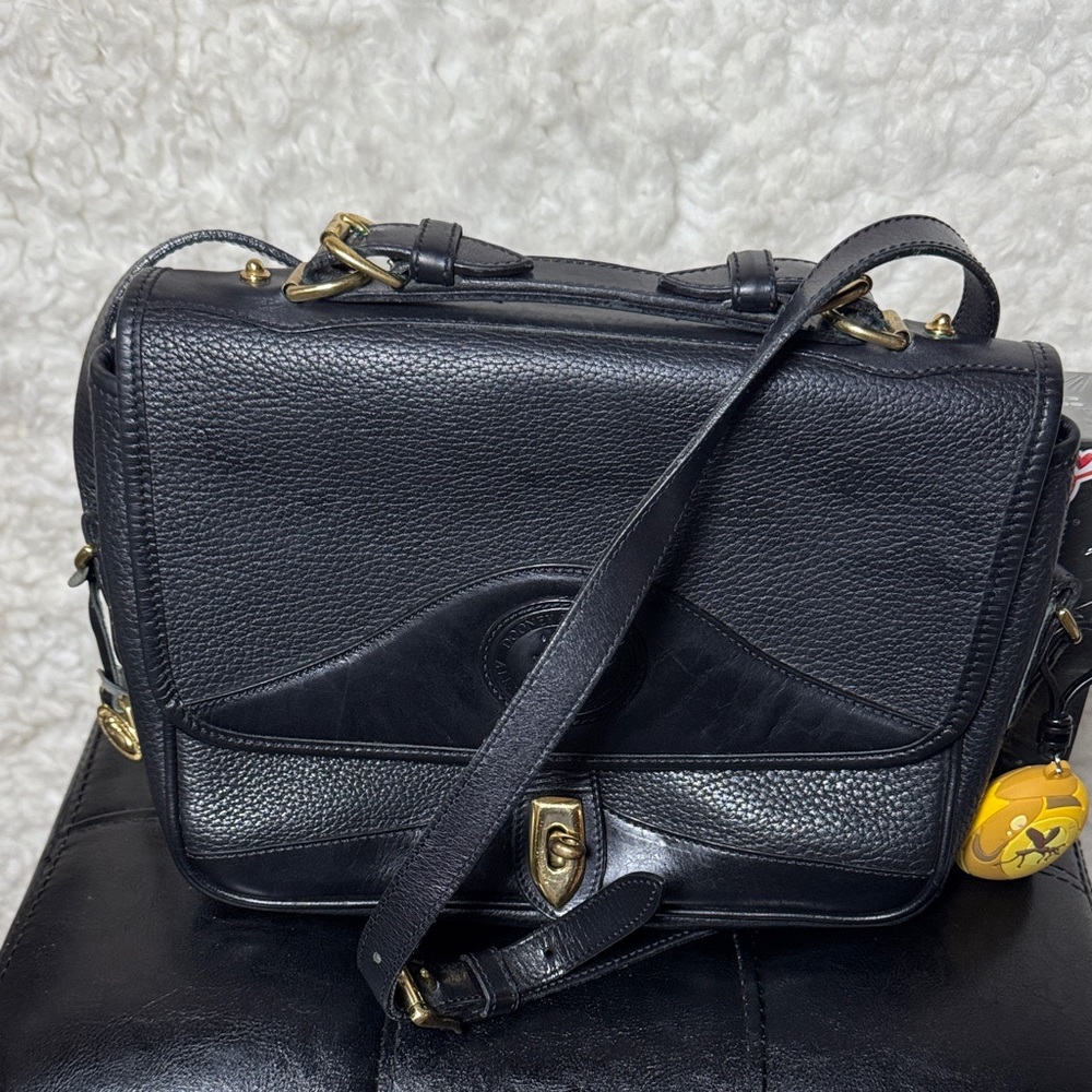 Dooney and Bourke vantage Black Leather Crossbody Bag with Gold Accents.